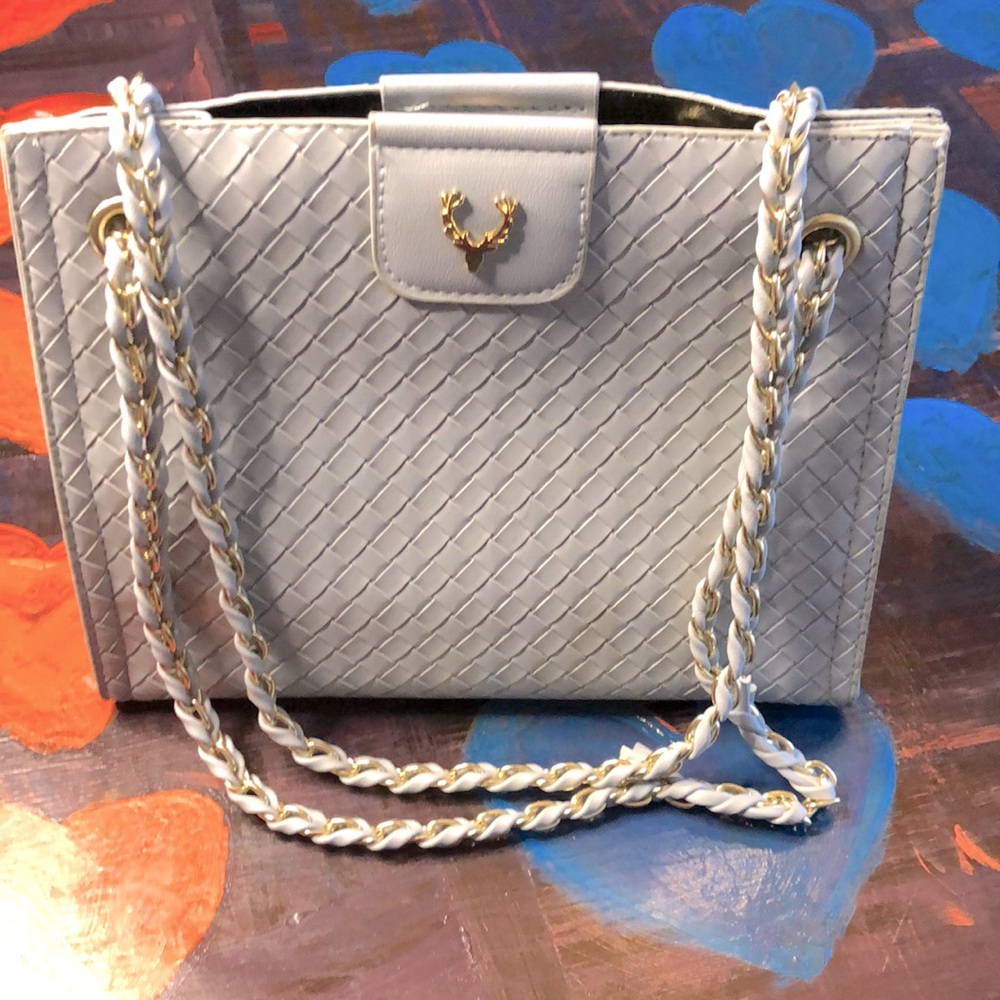 A fashion-forward Blue chain purse that will bring your style up a notch!